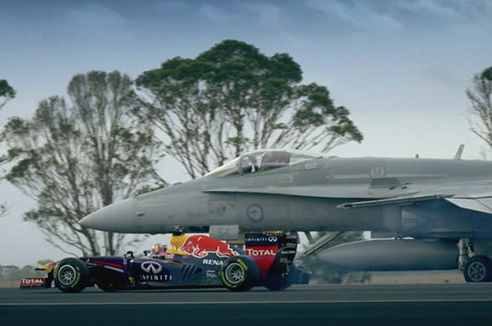 Speed thrills with Red Bull fast car racing an F18 jet
