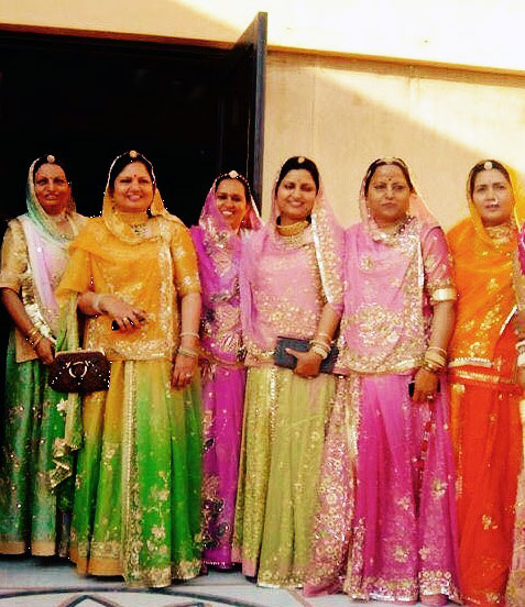 Rukhmani founders, Vineeta (first from left), Bindu (third from right) and Sunita (second from right) at a family wedding, wearing Rukhmani Poshaks
