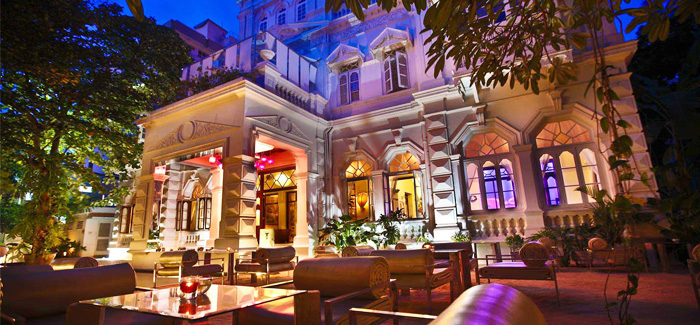 CASA COLOMBO | Retro chic is how the ruby red rooms of this eclectic property can be best defined