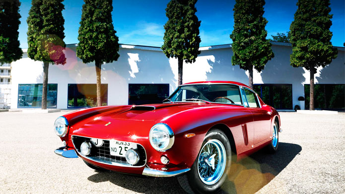RED BLOODED | Raupp’s composition of a striking red Ferrari posing pretty in front of the symmetrically aligned trees has made us fall in love, all over again!