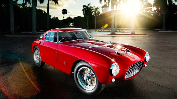RED HAUTE | A vintage Ferrari, in red color. A Tropical climate with majestic palm trees around. Life certainly doesn’t get any better than this!