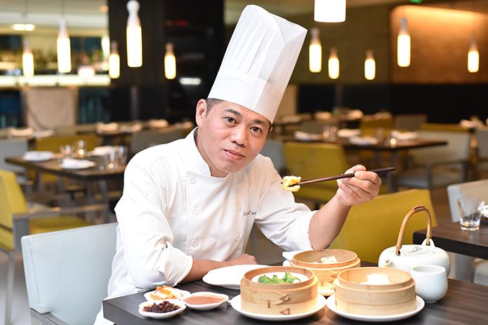 CHEF AT WORK | Chef Stanley LumWahCheok, the Head Chef for Yauatcha India, enjoys his favourite steamed dim sums with prawn or pork filling
