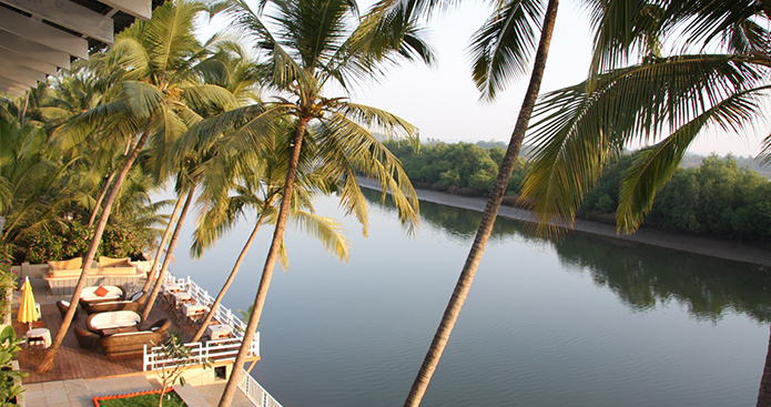 TRULY GOAN EXPERIENCE | Sit by the infinity pool at Casa Colvale for anincredible view of the backwaters, islands, whitewashed churches, sleepy riverside villages and lush Goan jungle stretching for miles