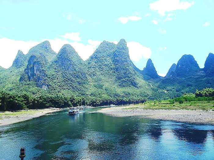 CHINA GUILIN | A dramatic landscape full of natural beauty and historic treasures, Guilin is not all limestone karst but also lakes which make for enjoyable boat rides