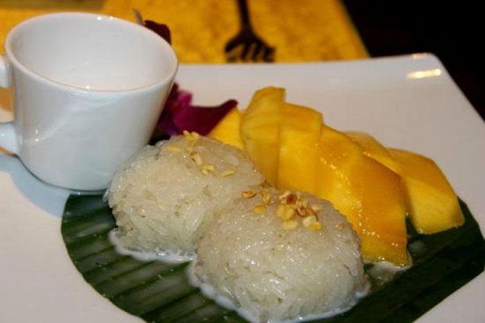 KHAO NIEW MAMNANG | Ending on a sweet note, this creamy Thai dessert pays respect to the heroes of tropical fruits, mango and coconut, which abound in the region and its cuisine