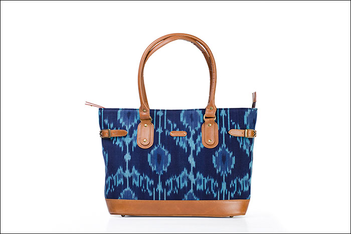 OCTOBER JAIPUR | An unorthodox blend of leather and Ikat Durrie work, this tote is for those who like their space, comfort with a generous dash of fun