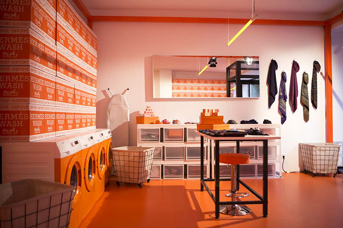 HERMESMATIC POP UP | Innovatively designed as a Laundromat, this store in Munich offered a whole range of Hermès classics silk creations like the scarves, mini bowties, twillys