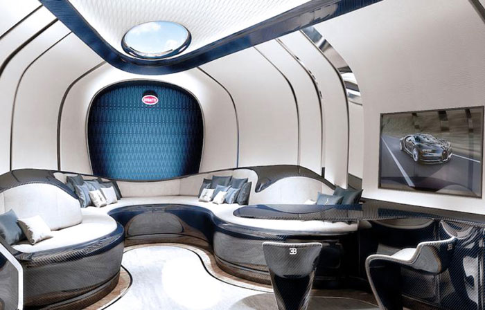 A signature Bugatti horseshoe shaped salon features heritage automotive traits, including the macaron skylight
