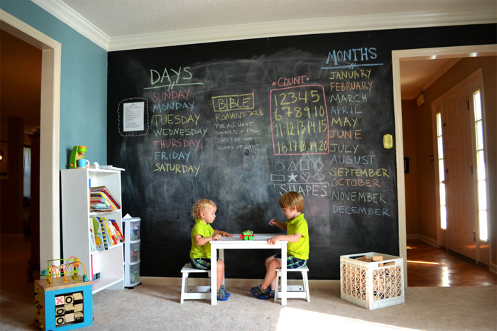 Painting the entire wall in chalkboard paint is a great investment since the kids can get creative with it