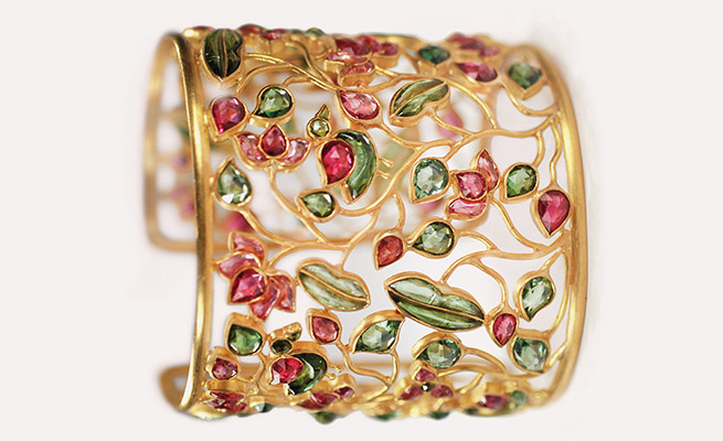Masterpieces like this Lotus flower bracelet are crafted using the traditional Indian technique, Kundun, where precious stones are cut paper-thin and inlaid with gold