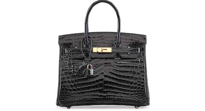A shiny black nilo crocodile Birkin 30 bag. Hermès, 2006. $53,500. 