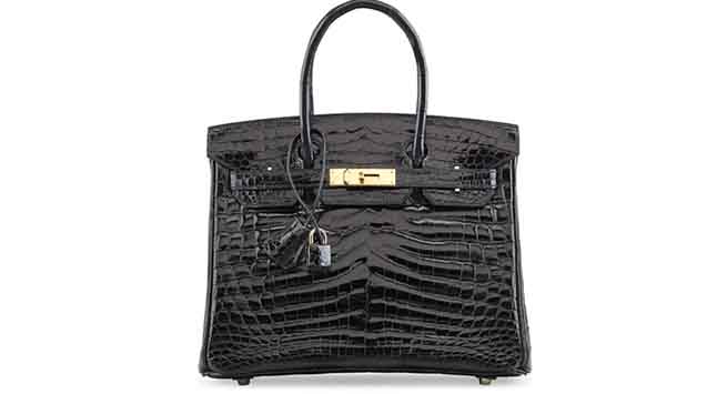 A shiny black nilo crocodile Birkin 30 bag. Hermès, 2006. $53,500.