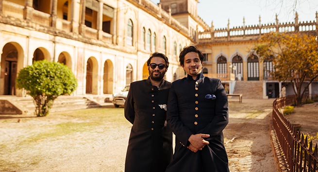 Princes Royale: Prof Ali Khan Mahmudabad (left) and Amir Khan Mahmudabad (Right), sons of the Raja, in the grounds of the Qila with the Baradari and Kothi in the background