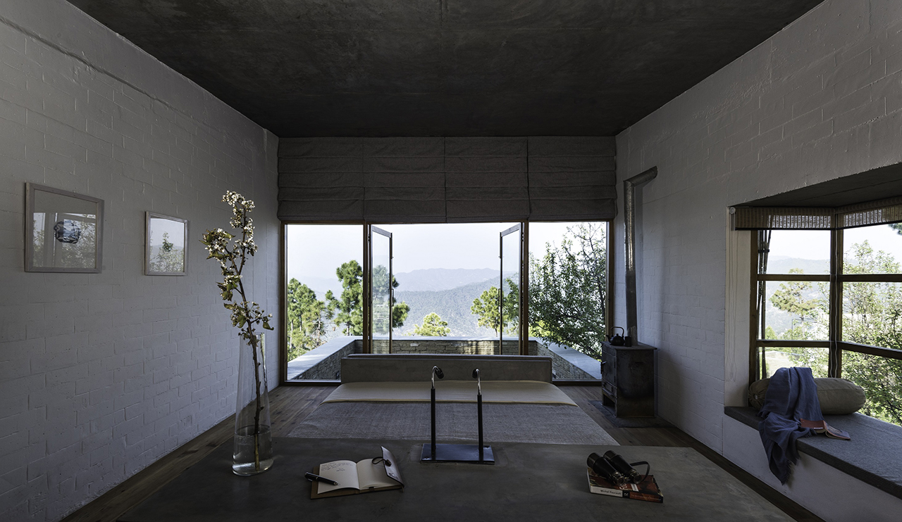 Upper Chalet at The Kumaon use fly-ash bricks clad with bamboo sticks and copper wire and have bay windows that extend out to large terraces