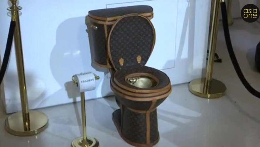 Luxury loo: A $100,000 golden toilet covered in Louis Vuitton bags !